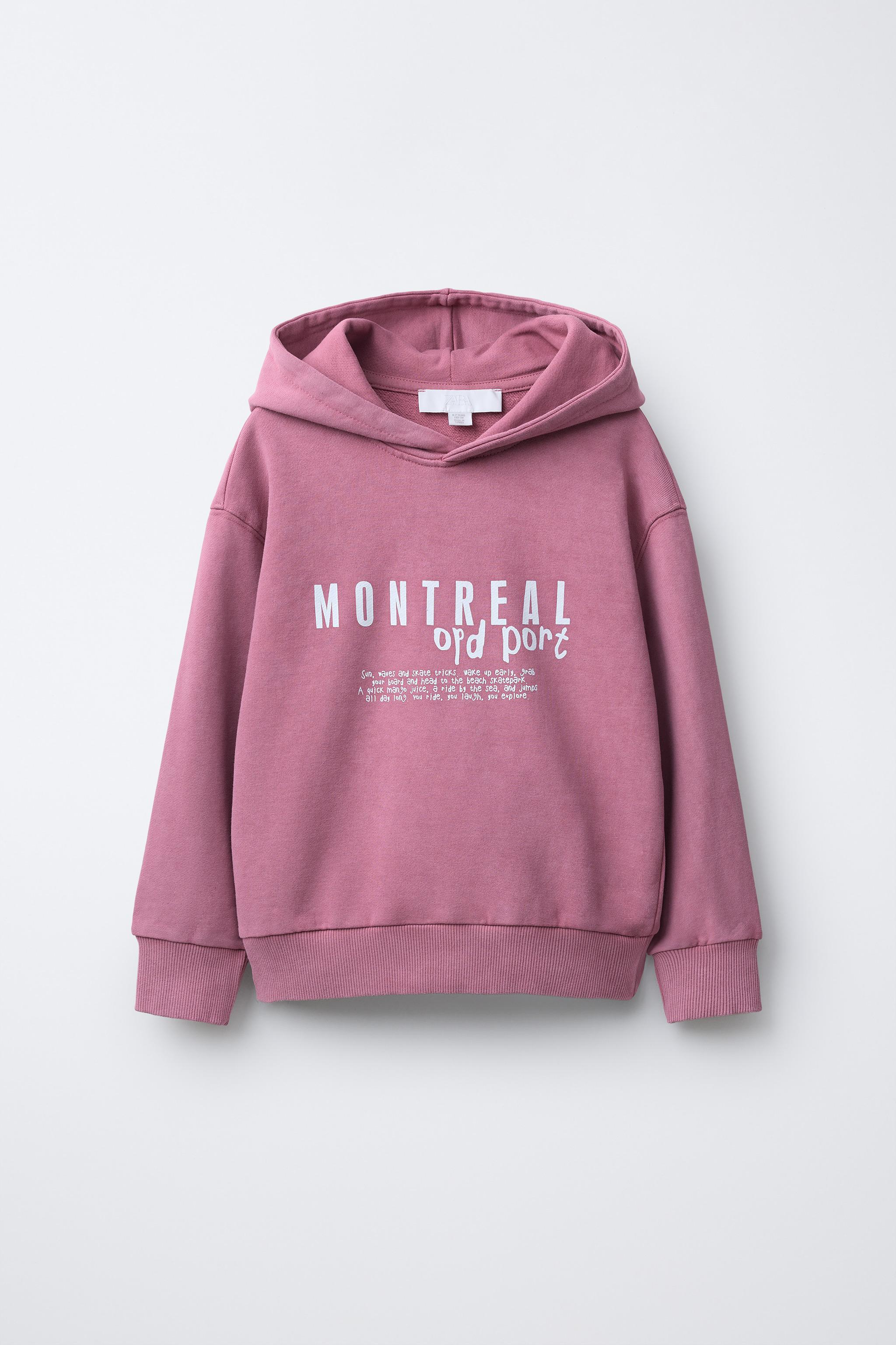 SWEAT À CAPUCHE ET INSCRIPTION